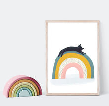 Load image into Gallery viewer, Print of a cat lying on top of a rainbow 
