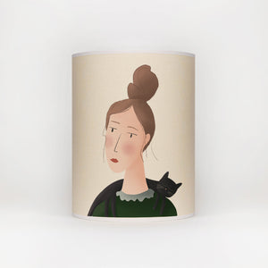 lamp shade with a picture of a lady with a cat draped over her shoulders