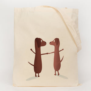 Picture of two dogs holding hands printed onto a cotton bag 