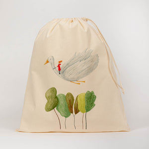 Flying duck over trees drawstring bag