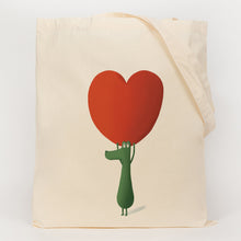 Load image into Gallery viewer, Crocodile holding up a giant heart printed onto a cotton tote bag  
