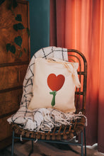 Load image into Gallery viewer, Crocodile holding up a giant heart printed onto a tote bag 
