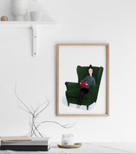Load image into Gallery viewer, Print of a lady sitting in an arm chair reading 
