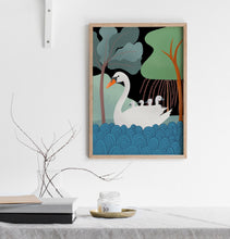 Load image into Gallery viewer, Print of a swan with her cygnets on her back on the water with trees in the background
