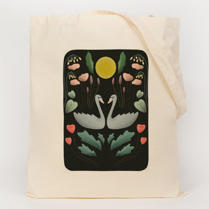 Symmetry picture of swans and plants printed onto along handle tote bag  