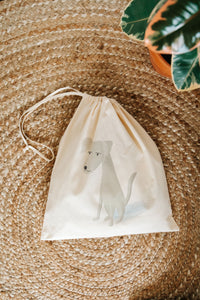 White dog drawstring bag