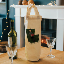 Load image into Gallery viewer, lady in chair reading wine tote 
